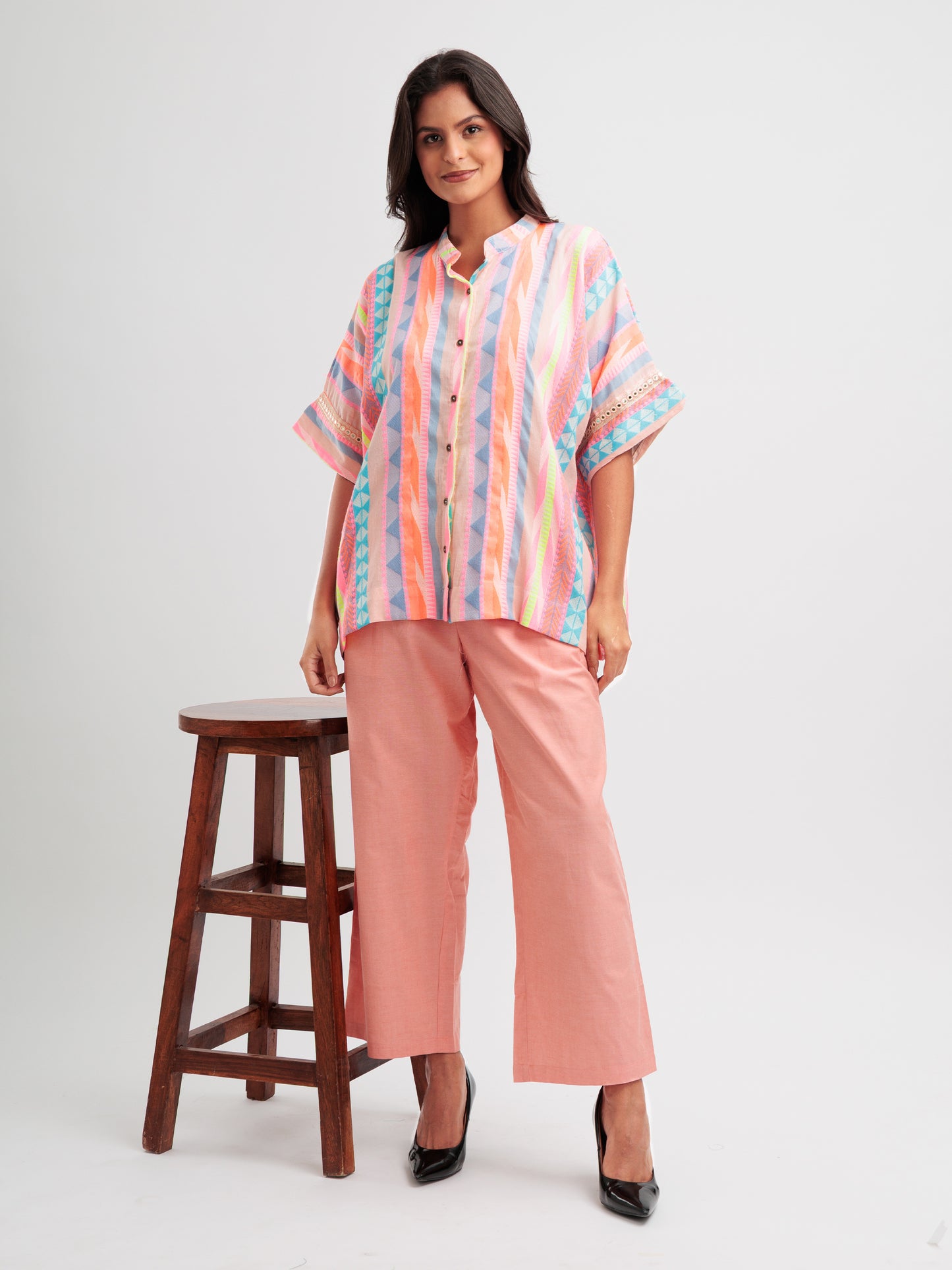 Radiant Rhythm kaftan shirt featuring multicoloured stripes and geometric lace on sleeve details.