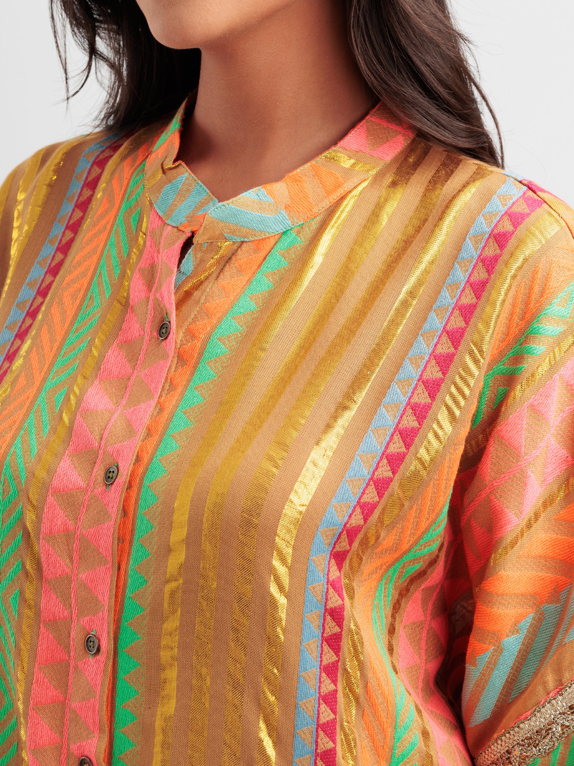 Amber Glow kaftan shirt featuring metallic gold stripes and vibrant geometric patterns.