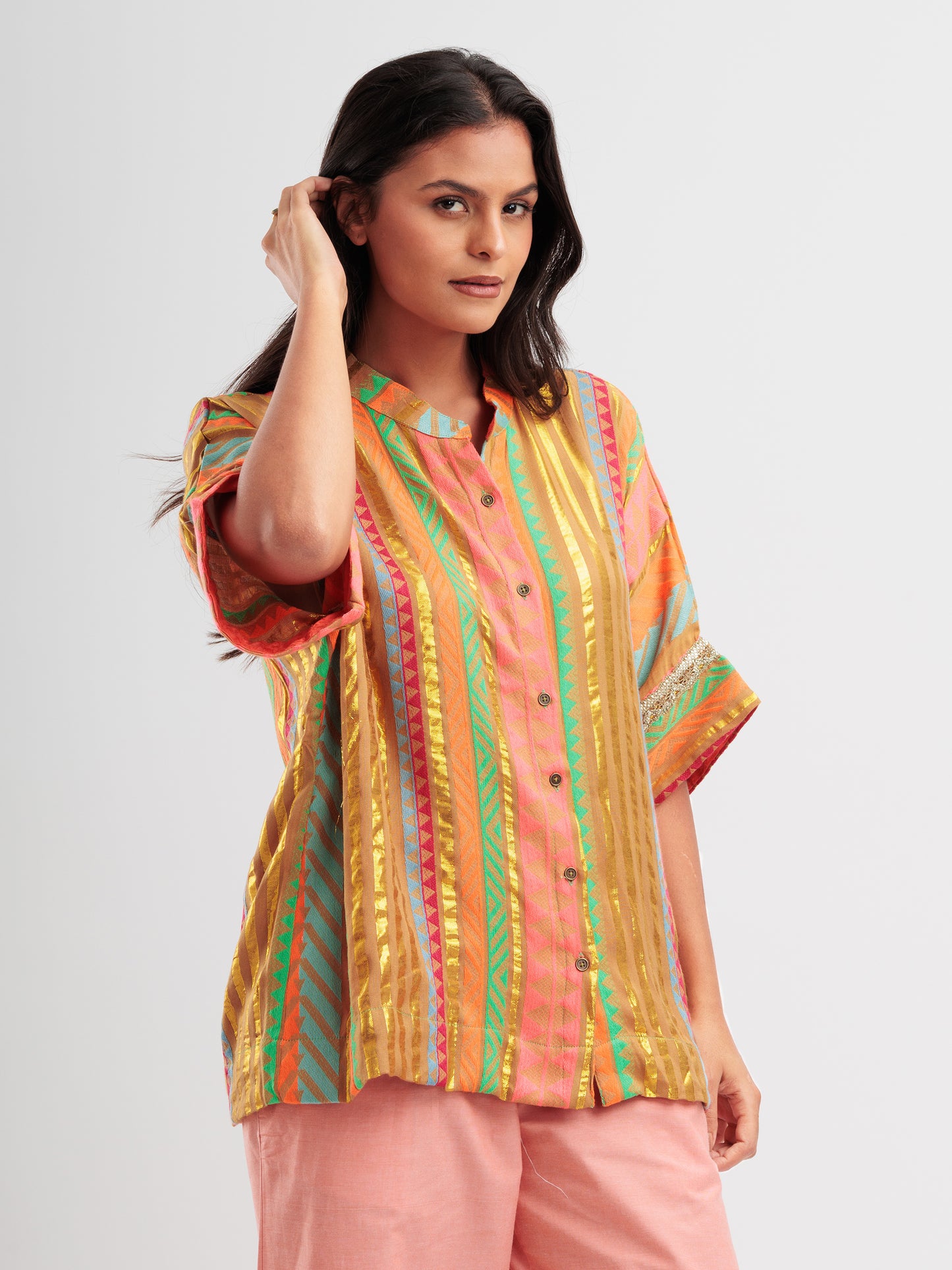 Amber Glow kaftan shirt featuring metallic gold stripes and vibrant geometric patterns.