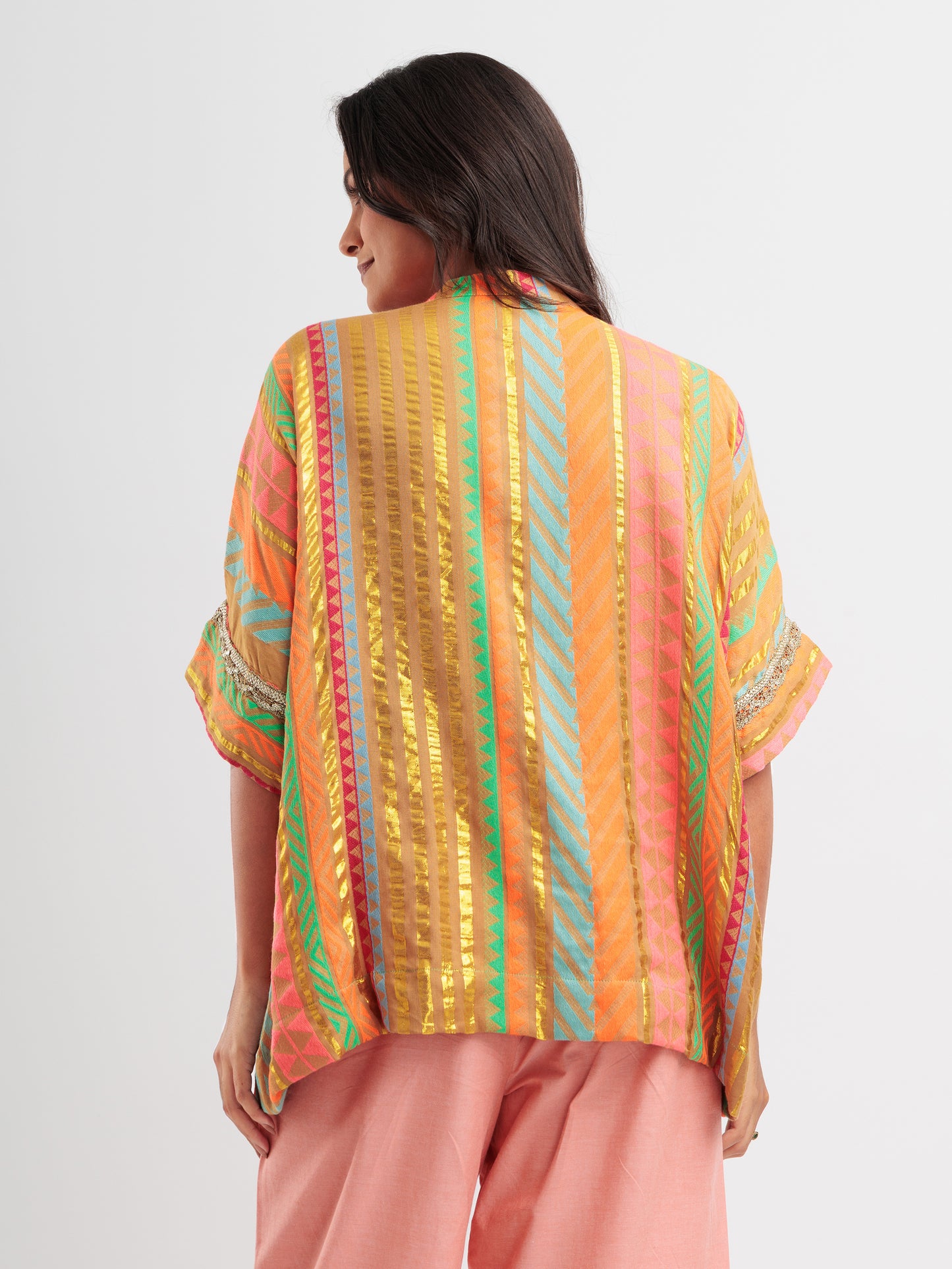 Amber Glow kaftan shirt featuring metallic gold stripes and vibrant geometric patterns.