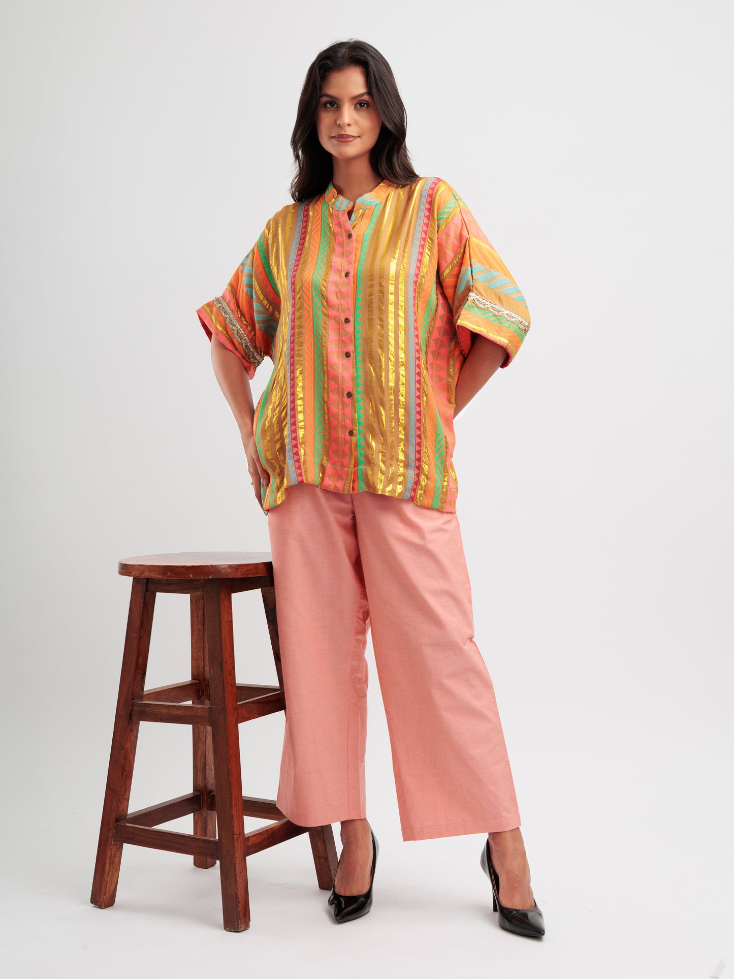 Amber Glow kaftan shirt featuring metallic gold stripes and vibrant geometric patterns.