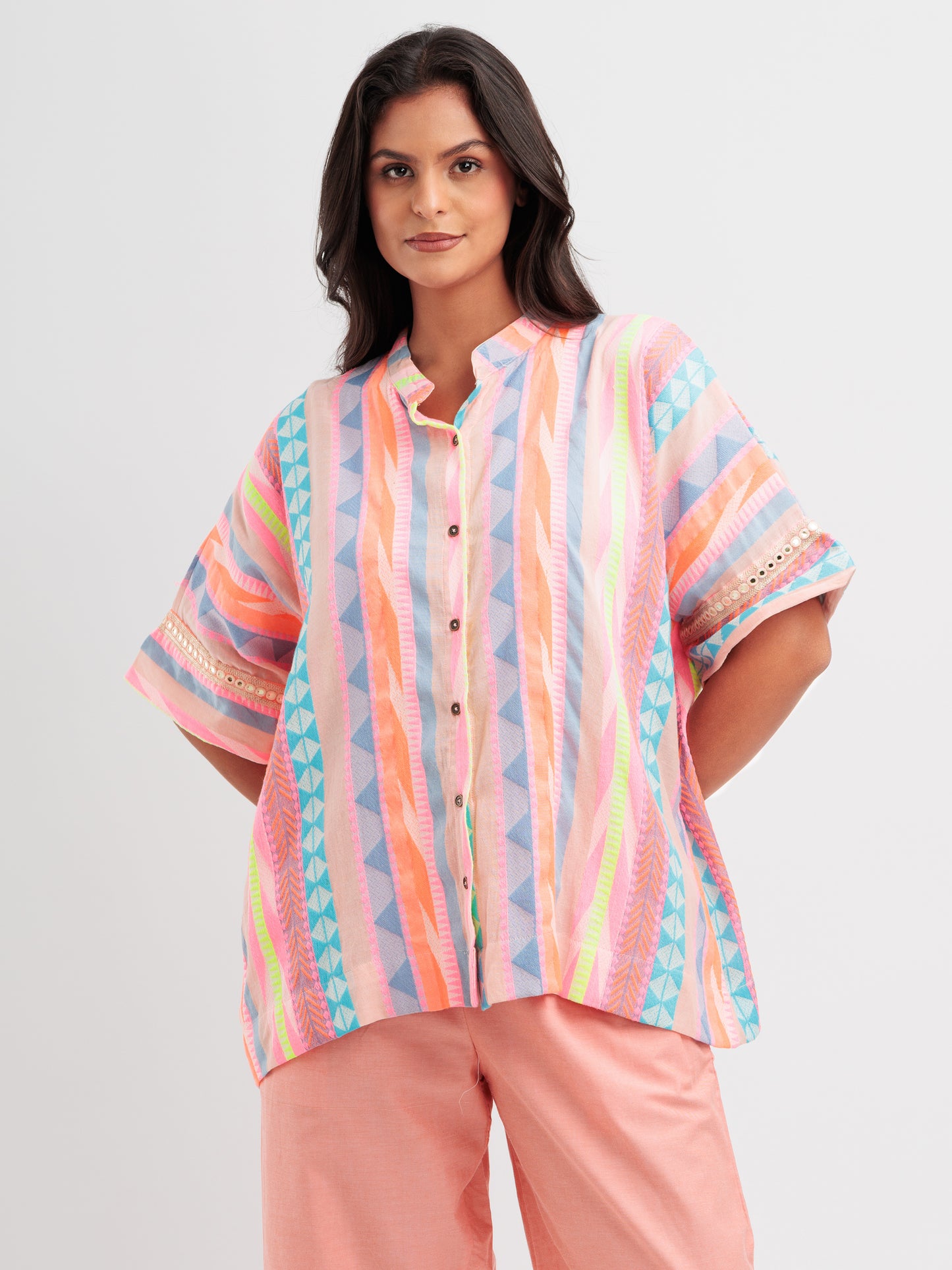 Radiant Rhythm kaftan shirt featuring multicoloured stripes and geometric lace on sleeve details.