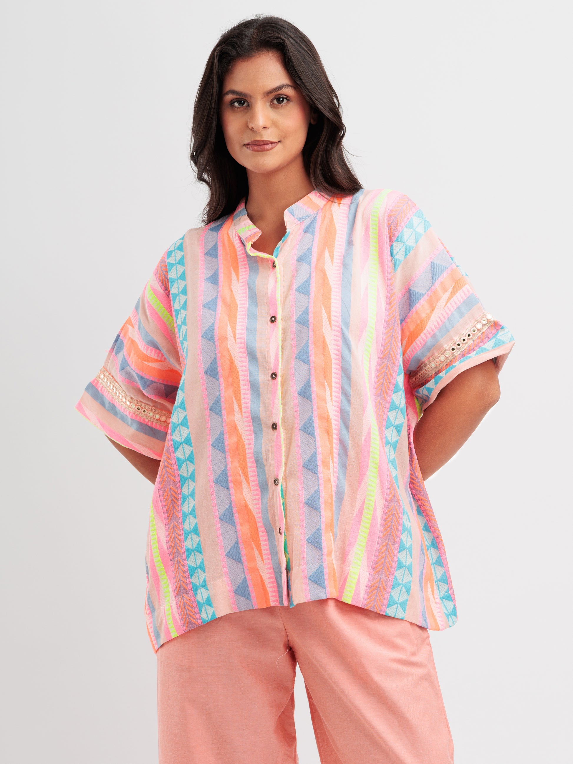 Radiant Rhythm kaftan shirt featuring multicoloured stripes and geometric lace on sleeve details.