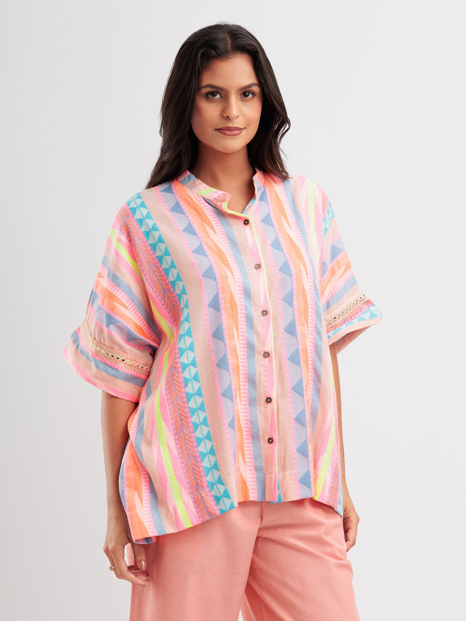 Radiant Rhythm kaftan shirt featuring multicoloured stripes and geometric lace on sleeve details.