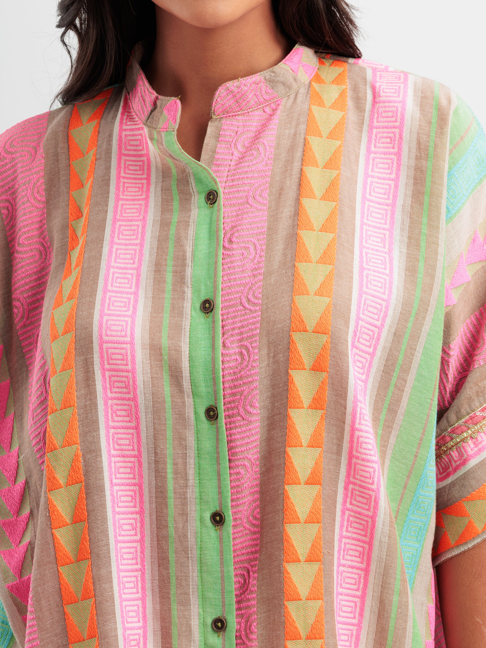 Vibrant striped kaftan shirt with pink, mint, and orange vertical stripes and geometric detailing.
