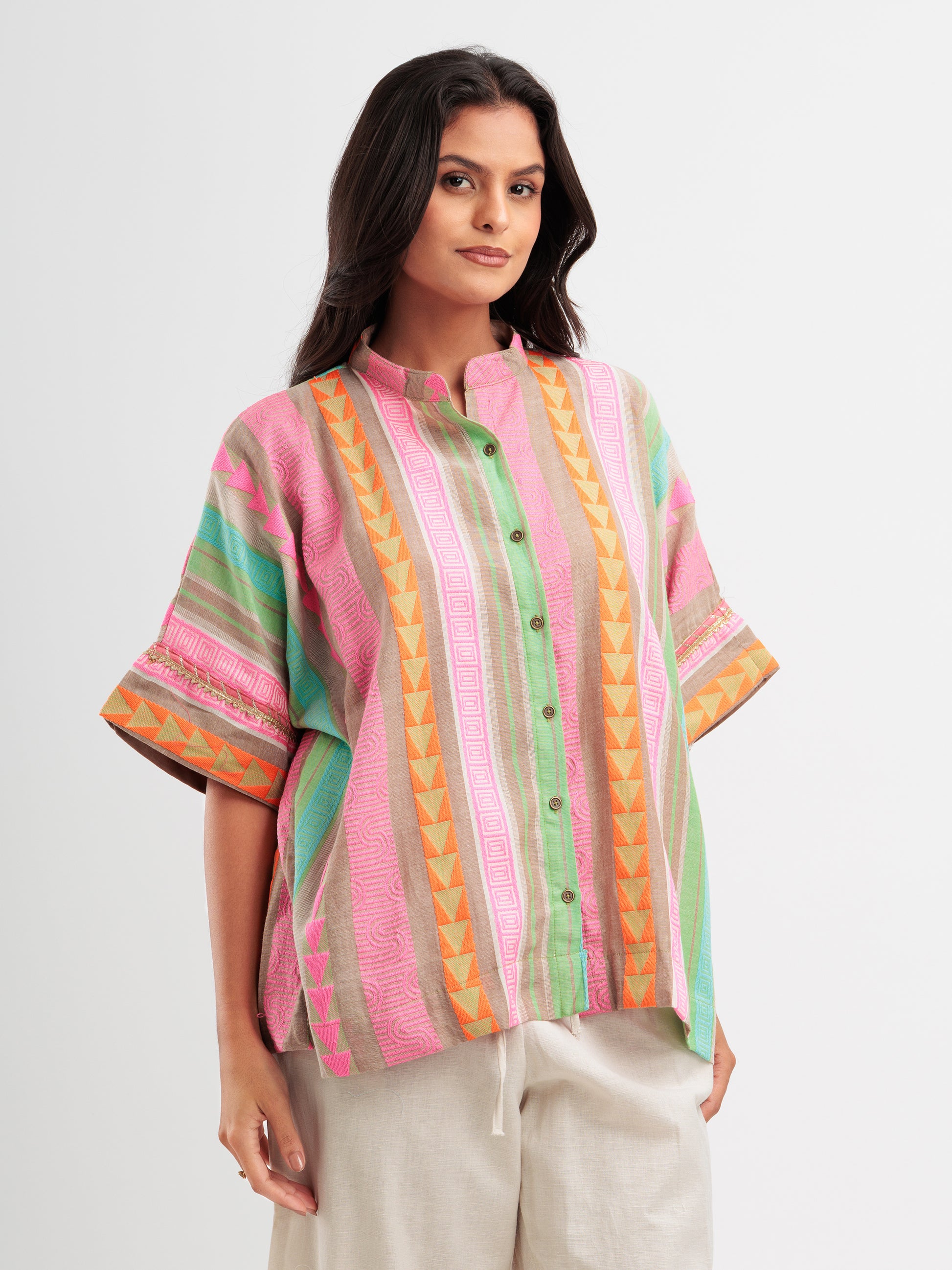 Vibrant striped kaftan shirt with pink, mint, and orange vertical stripes and geometric detailing.