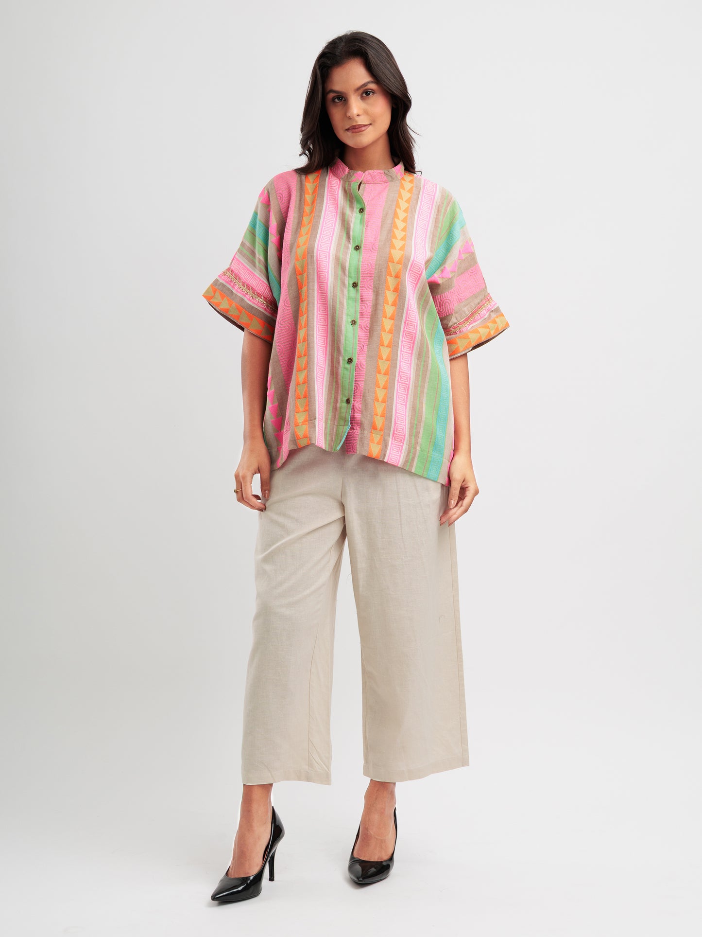 Vibrant striped kaftan shirt with pink, mint, and orange vertical stripes and geometric detailing.